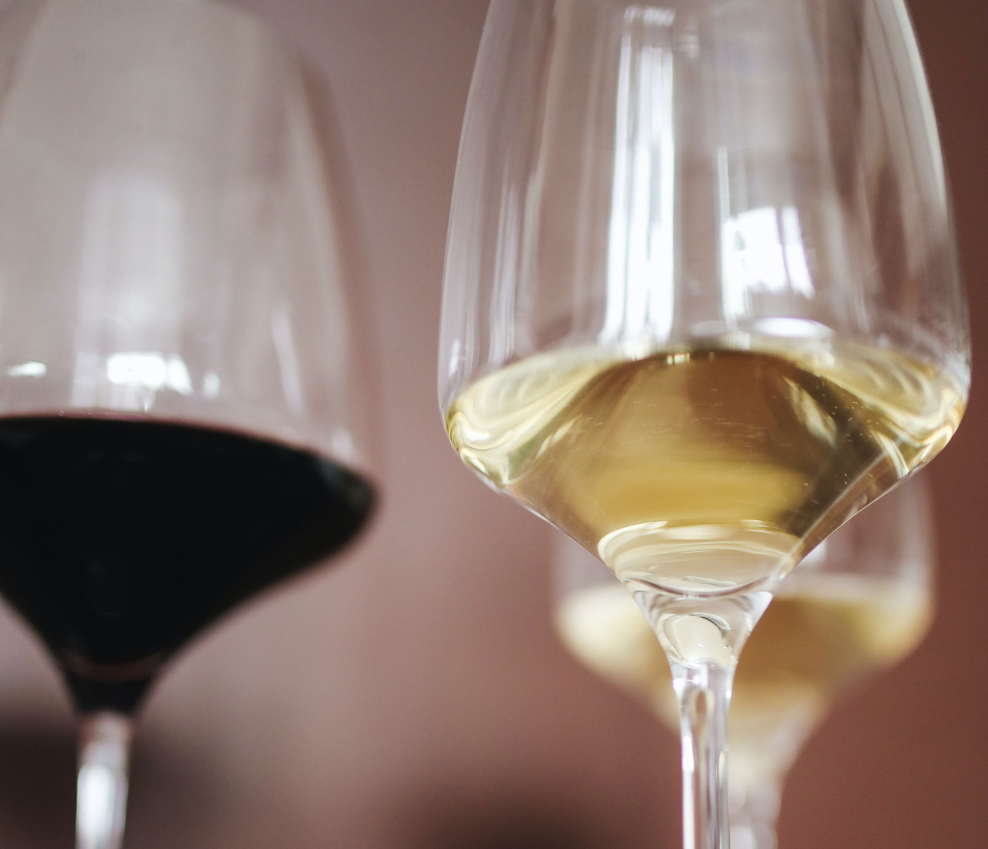 Red and white wine glasses in close-up