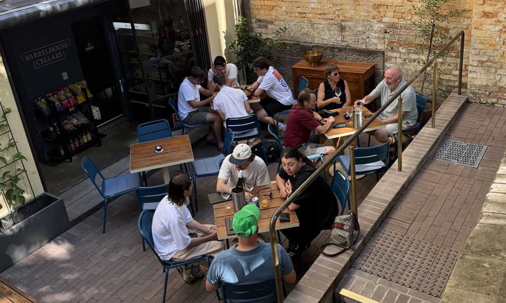 Guests seated in the Garden Bar courtyard